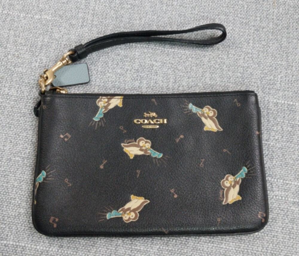 Coach Corner Zip wristlet with penquins
